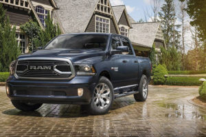 a blue 2018 dodge ram crew cab in a driveway