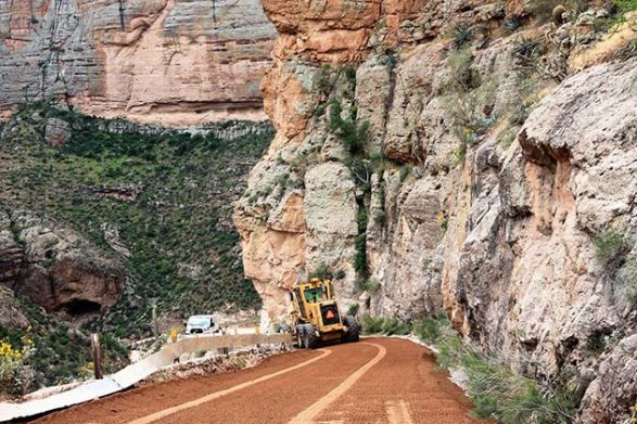 heavy duty machinery repaves the apache trail scenic drive in arizona