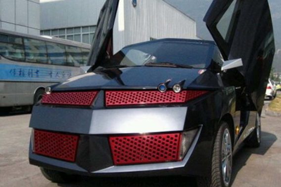 a completely custom Pontiac Aztek that is black and red resembling RoboCop or Transformers with scissor doors