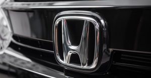 a honda logo on the front of a car
