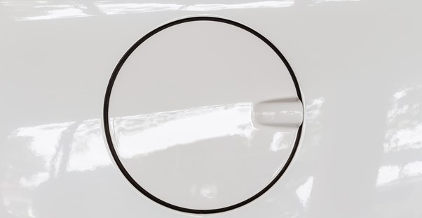 a car fuel cap cover in white paint