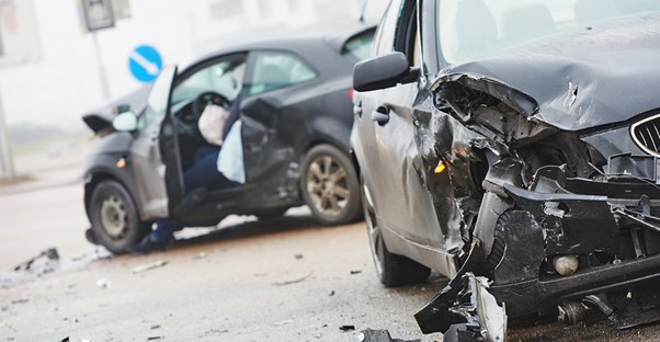 a car crash scene symbolizing the importance of auto insurance