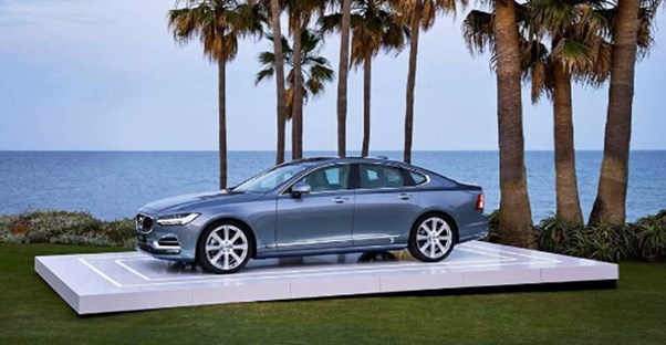 a gray 2017 volvo s60 in front of the ocean