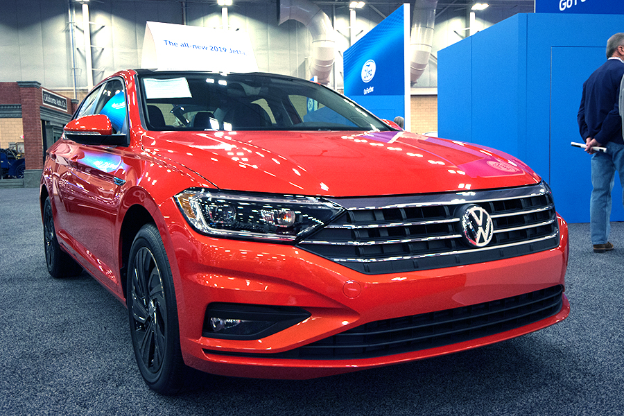 a red 2019 volkswagen jetta at a car show
