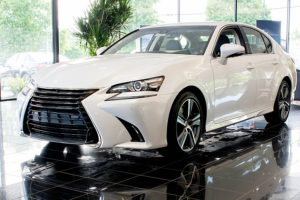 a white 2017 lexus gs in a showroom