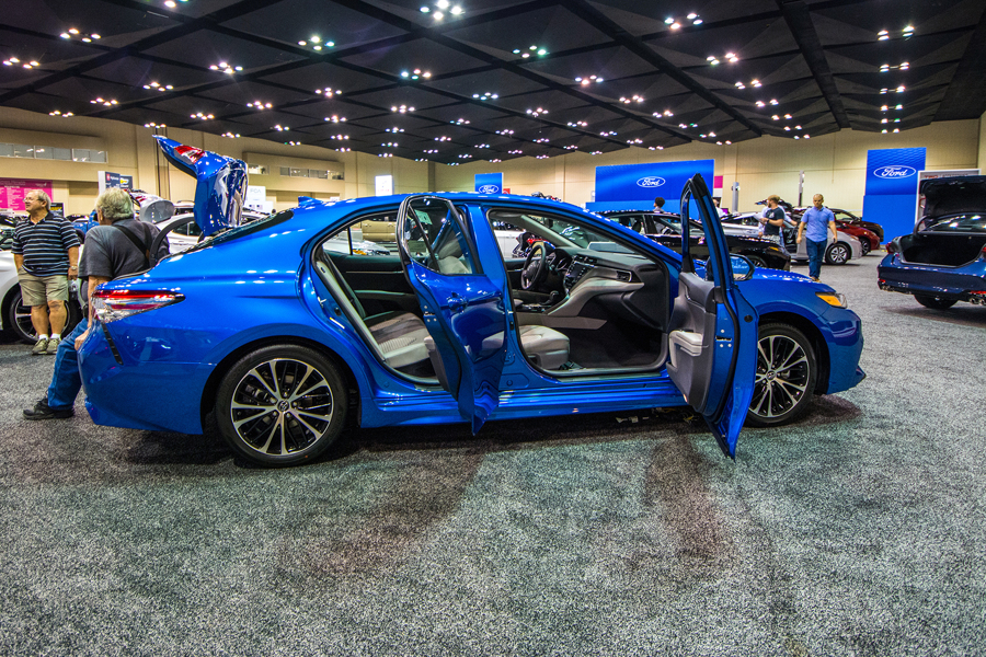 a blue 2019 toyota camry with the doors and trunk open