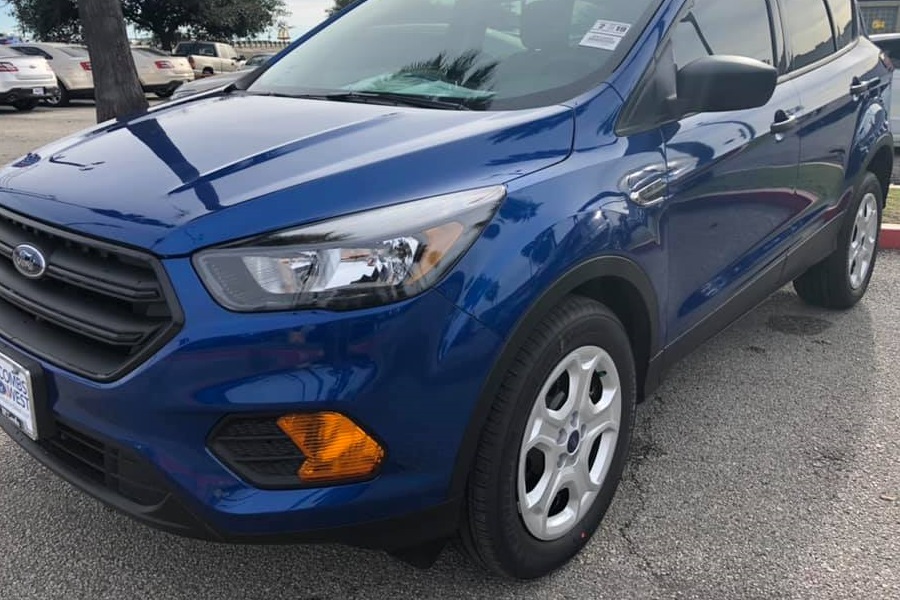 a close up of a blue 2019 ford escape