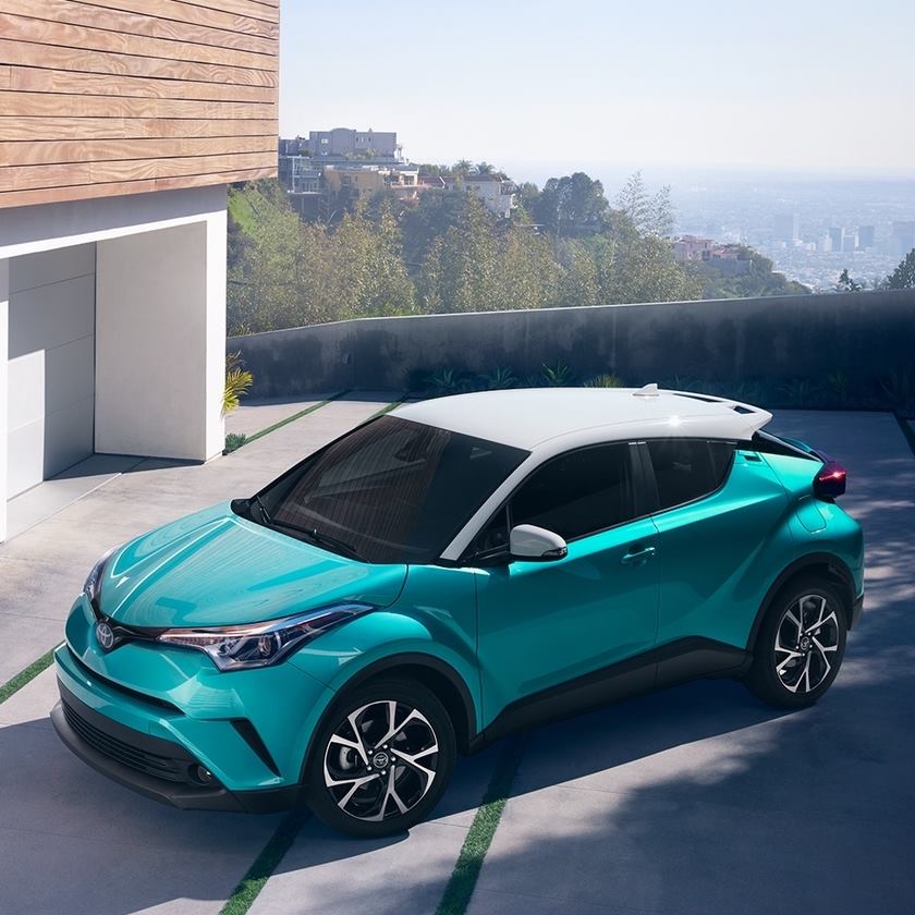 a white and teal 2018 toyota c-hr
