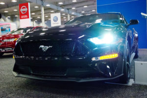 light shining from the headlight of a 2018 ford mustang