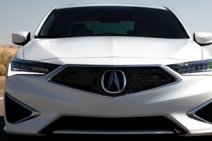 the front grille of a white 2019 acura ilx