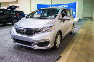 a silver 2019 honda fit at an auto show