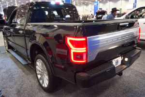 the tailgate of a black 2018 ford f-150