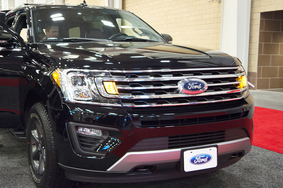 a black 2018 ford expedition at an auto show