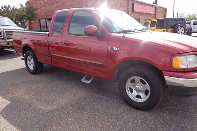 a red 2002 ford f-150