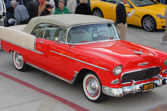 a red chevy bel air with a tan convertible top