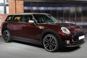 a maroon mini cooper with white roof