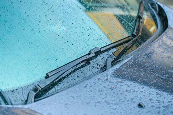 car wiper blades as rain comes down on top of them