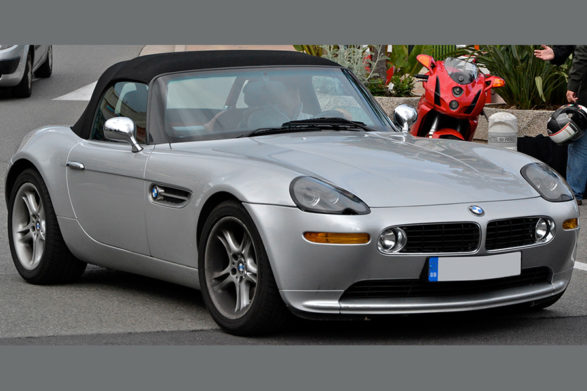 a silver bmw z8 convertible with the black top up