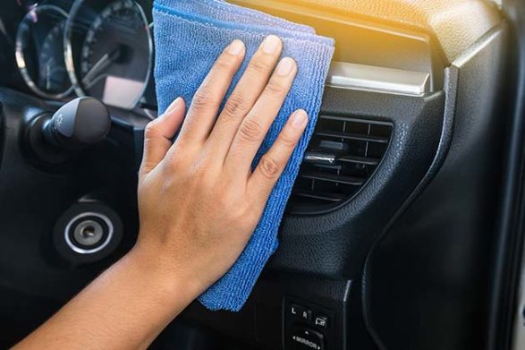 cleaning a car air vent with a cloth