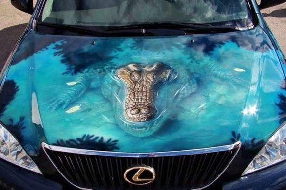 a car with a paint job that looks like an alligator is coming out of the hood