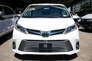 the front grille of a white 2020 toyota sienna