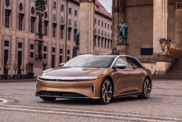 a bronze lucid air parked for a stylish photoshoot