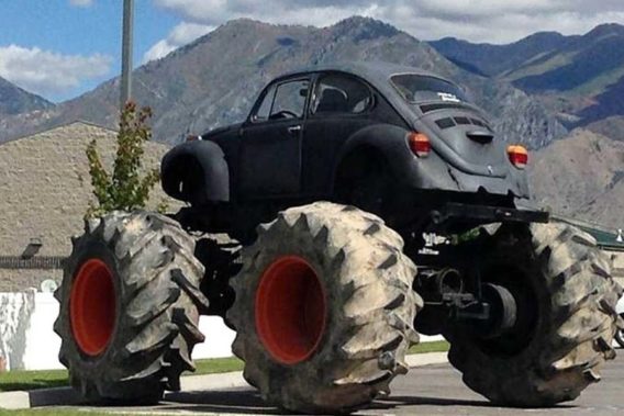 a volkswagen beetle with monster truck tires