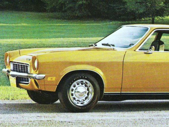 only the front half of a yellow chevrolet vega is visible