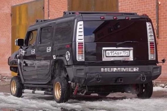 a large hummer with comically undersized small tires