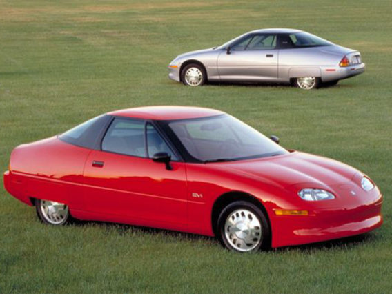 a red ev1 in the foreground and a silver ev1 in the background