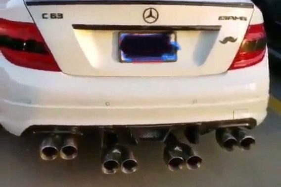 a mercedes with 8 exhaust pipes out of the rear