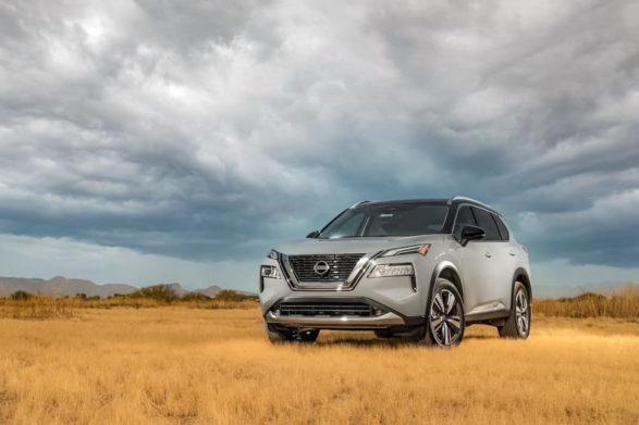 a gray 2021 nissan rogue in a field