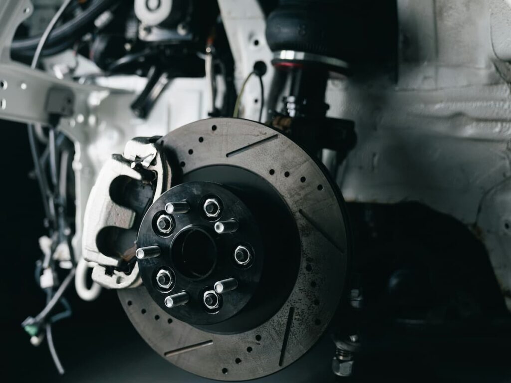 the brake pads of a car in the shop